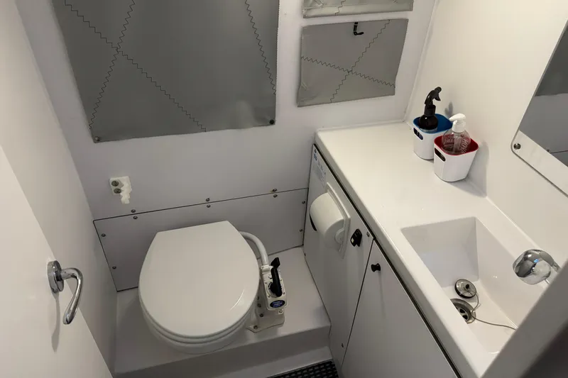 Expresso Yacht Photos Pics Compact bathroom in a 2019 Pogo 36 yacht, featuring a toilet and sink.