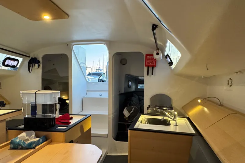 Expresso Yacht Photos Pics Interior of 2019 Pogo 36 sailboat, featuring modern kitchen and seating area.