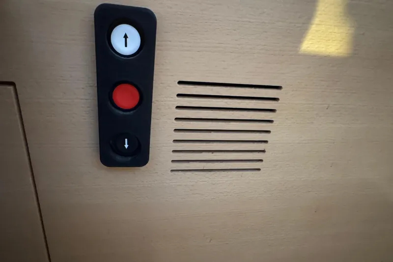 Expresso Yacht Photos Pics Control panel with buttons on a Pogo 36, 2019 model, featuring up and down arrows.