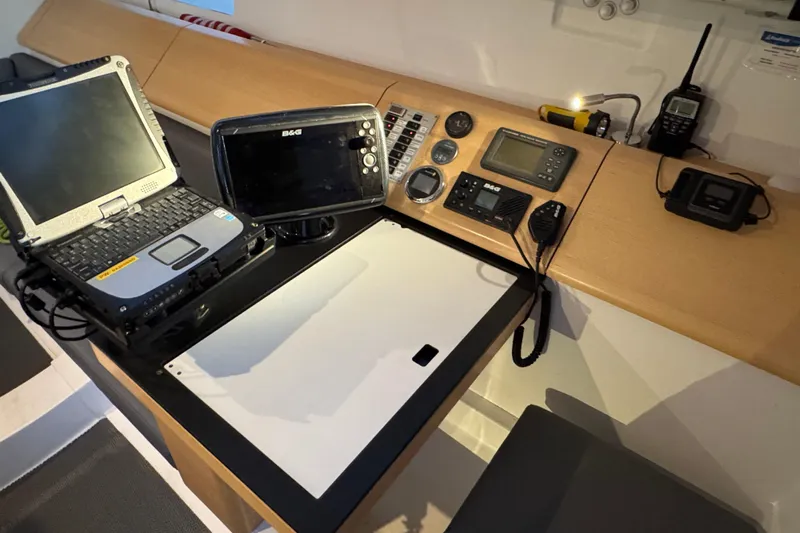Expresso Yacht Photos Pics Navigation equipment setup on a 2019 Pogo 36 sailboat, featuring laptop and marine electronics.
