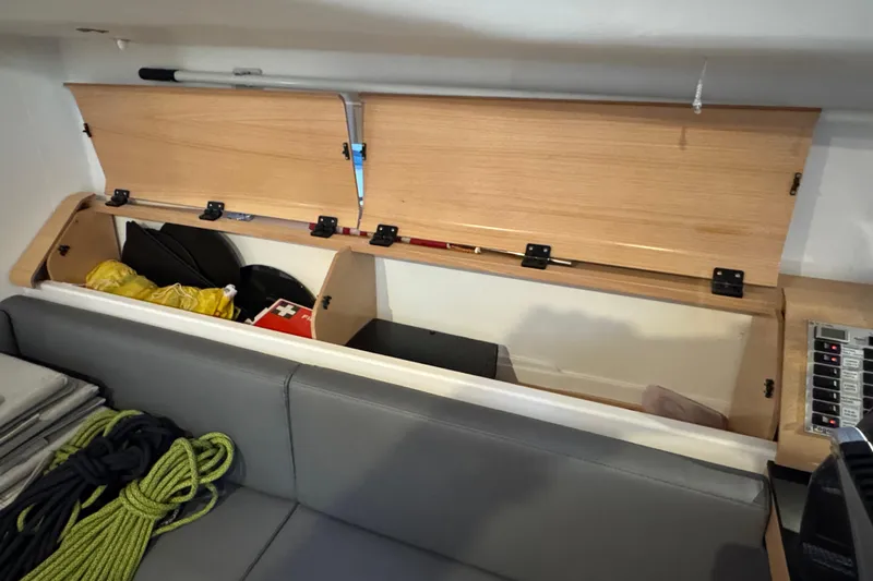 Expresso Yacht Photos Pics Storage compartment in a 2019 Pogo 36 sailboat with ropes and safety equipment.