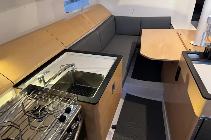 Expresso Yacht Photos Pics Modern interior of 2019 Pogo 36 yacht with kitchen and seating area.