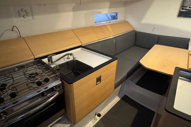 Expresso Yacht Photos Pics Modern interior of 2019 Pogo 36 yacht with kitchen and seating area.