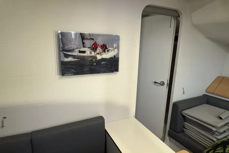 Expresso Yacht Photos Pics Interior of a 2019 Pogo 36 sailboat with a sailing photo on the wall.