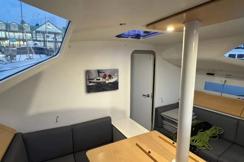 Expresso Yacht Photos Pics Interior of 2019 Pogo 36 sailboat with modern seating and large windows.