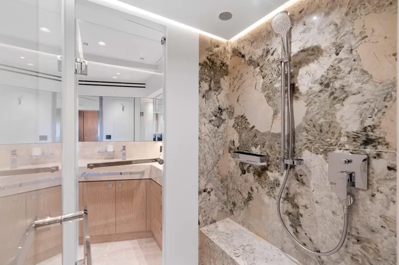 Horizon Fd100-914 / Available Flibs 2025 Yacht Photos Pics Luxurious bathroom in 2026 Horizon FD100 yacht with marble shower and modern fixtures.