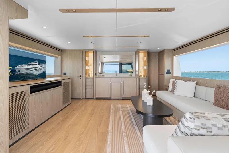 Horizon Fd100-914 / Available Flibs 2025 Yacht Photos Pics Luxurious interior of 2026 Horizon FD100 yacht with modern furnishings and panoramic windows.