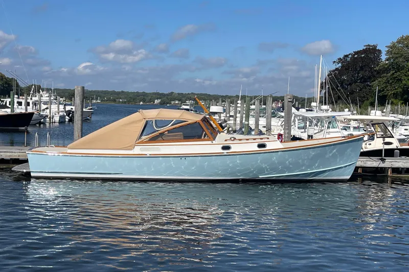 Sea Glass Yacht Photos Pics 2015 CH Marine Shelter Island Runabout docked at a marina under a clear blue sky.