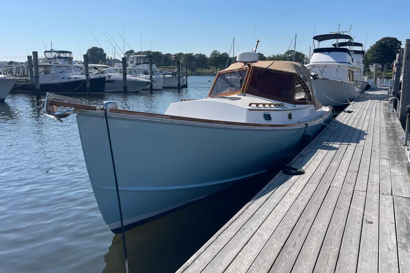 Sea Glass Yacht Photos Pics 2015 CH Marine Shelter Island Runabout docked at a marina on a sunny day.