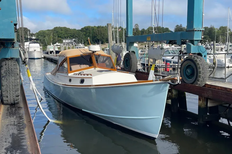 Sea Glass Yacht Photos Pics 2015 CH Marine Shelter Island Runabout docked at marina, surrounded by boats and equipment.