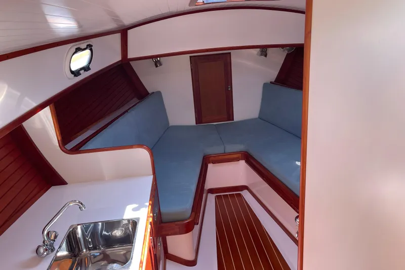 Sea Glass Yacht Photos Pics Interior of 2015 CH Marine Shelter Island Runabout with cozy seating and compact sink.
