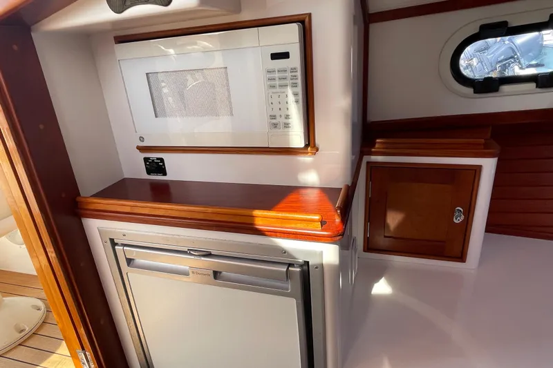 Sea Glass Yacht Photos Pics 2015 CH Marine Shelter Island Runabout interior with microwave and fridge.