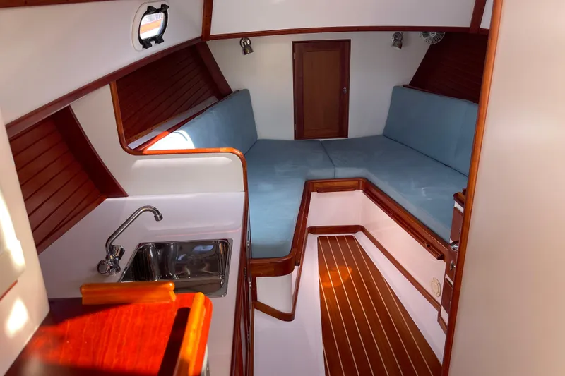 Sea Glass Yacht Photos Pics 2015 CH Marine Shelter Island Runabout interior with wood accents and cozy seating area.