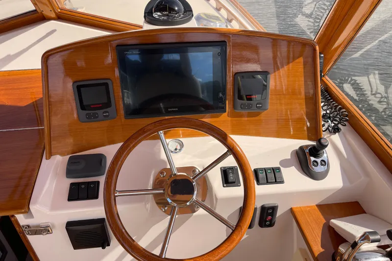 Sea Glass Yacht Photos Pics 2015 CH Marine Shelter Island Runabout dashboard with wooden steering wheel and navigation controls.