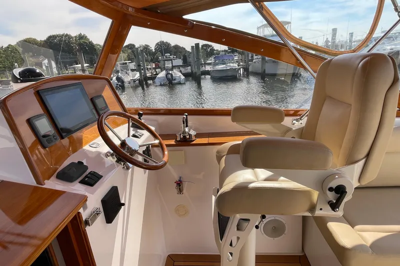 Sea Glass Yacht Photos Pics Interior of 2015 CH Marine Shelter Island Runabout with steering wheel and navigation controls.