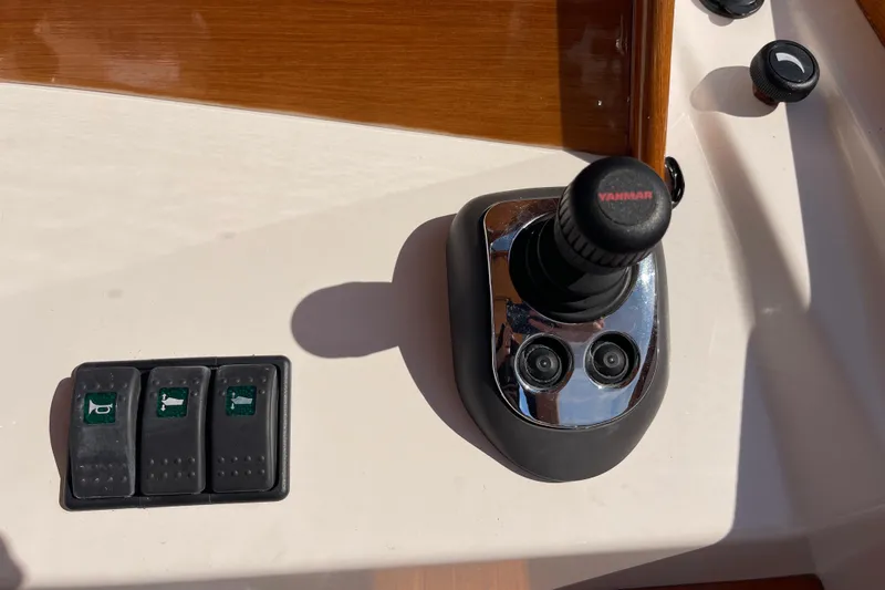 Sea Glass Yacht Photos Pics Control panel of a 2015 CH Marine Shelter Island Runabout with joystick and switches.