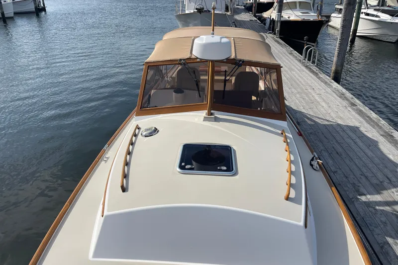 Sea Glass Yacht Photos Pics 2015 CH Marine Shelter Island Runabout docked at a marina, showcasing elegant design.