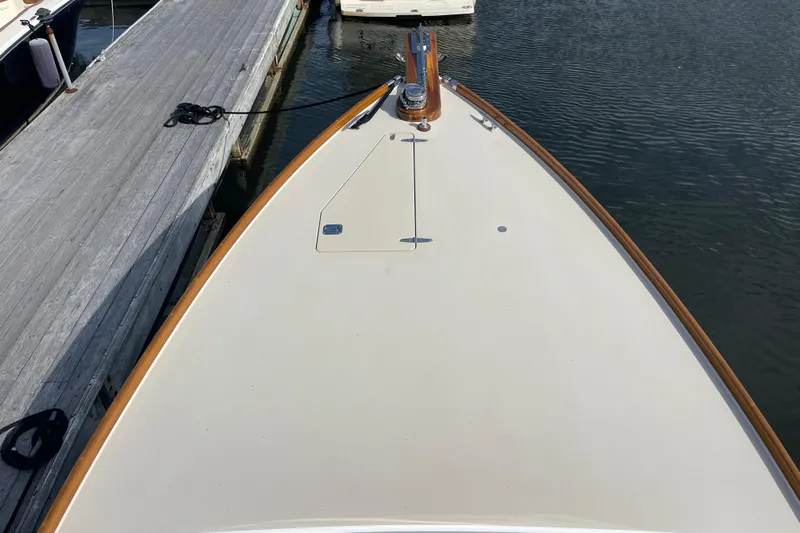 Sea Glass Yacht Photos Pics 2015 CH Marine Shelter Island Runabout docked, showcasing sleek bow design and wooden accents.