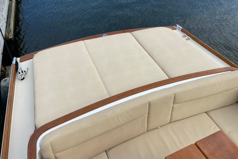 Sea Glass Yacht Photos Pics 2015 CH Marine Shelter Island Runabout with beige seating and wooden accents by the water.