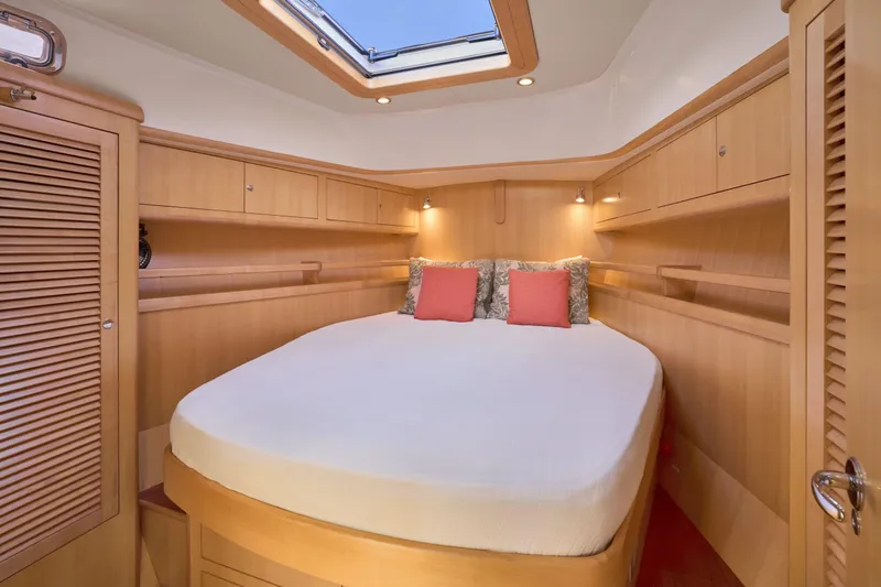 Cinchona Yacht Photos Pics Luxurious cabin interior of 2020 Outbound 52 yacht with skylight and cozy bed.