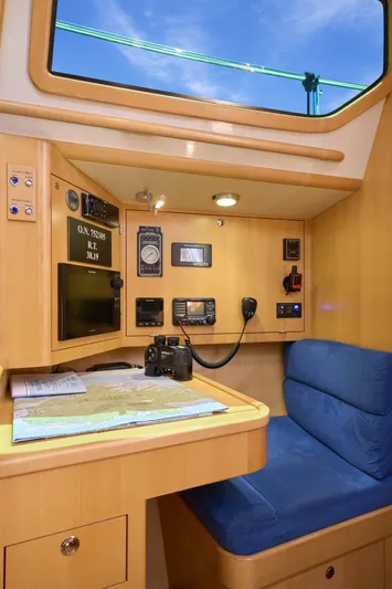 Cinchona Yacht Photos Pics Navigation station in 2020 Outbound 52 yacht with blue seat and equipment.