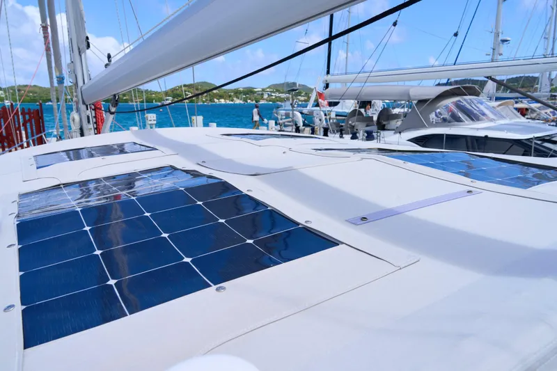 Cinchona Yacht Photos Pics Sailboat with solar panels on deck, Outbound 52, 2020 model, docked in a marina.