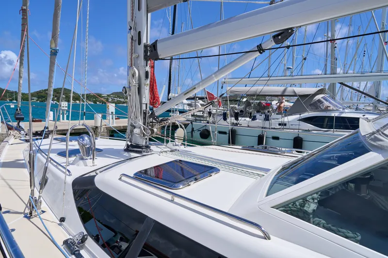 Cinchona Yacht Photos Pics Sailing yacht Outbound 52, 2020 model, docked at marina with clear blue skies.