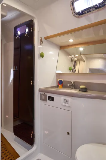 Cinchona Yacht Photos Pics Modern bathroom interior in 2020 Outbound 52 yacht, featuring sleek design and ample lighting.