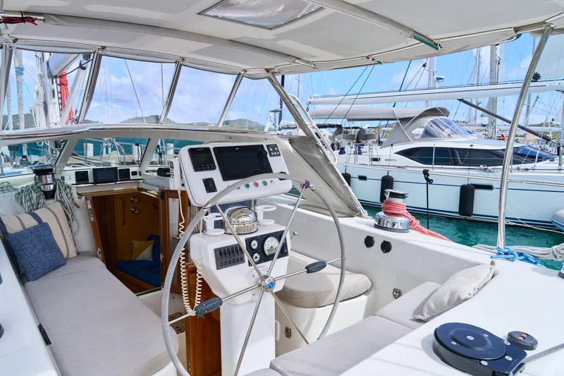 Cinchona Yacht Photos Pics Cockpit of 2020 Outbound 52 yacht with steering wheel and navigation equipment.