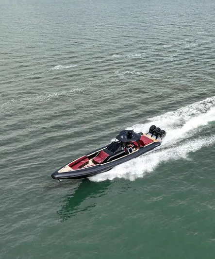 Yacht Photos Pics 2023 Revolt Comfort 47 boat cruising on open water, showcasing sleek design and powerful engines.