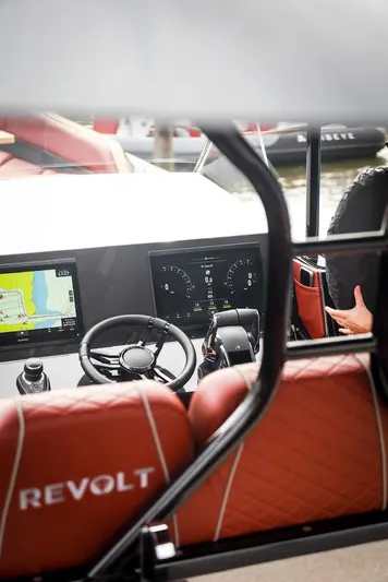 Yacht Photos Pics Interior view of 2023 Revolt Comfort 47 boat with modern dashboard and navigation system.