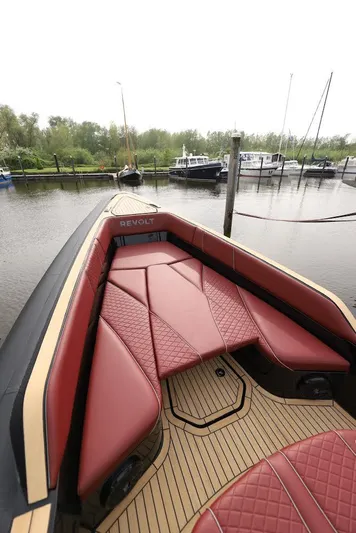  Yacht Photos Pics 2023 Revolt Comfort 47 boat with luxurious red seating and sleek design.