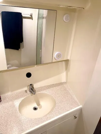 Woodcutter Yacht Photos Pics Bathroom sink area in 2000 Custom Carolina 56 East Bay yacht.