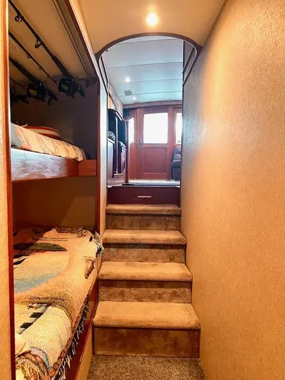 Woodcutter Yacht Photos Pics Interior of 2000 Custom Carolina 56 East Bay yacht with cozy bunk beds and carpeted stairs.