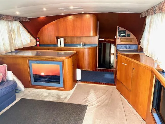 Woodcutter Yacht Photos Pics Interior of 2000 Custom Carolina 56 East Bay yacht with wood finishes and sunset artwork.