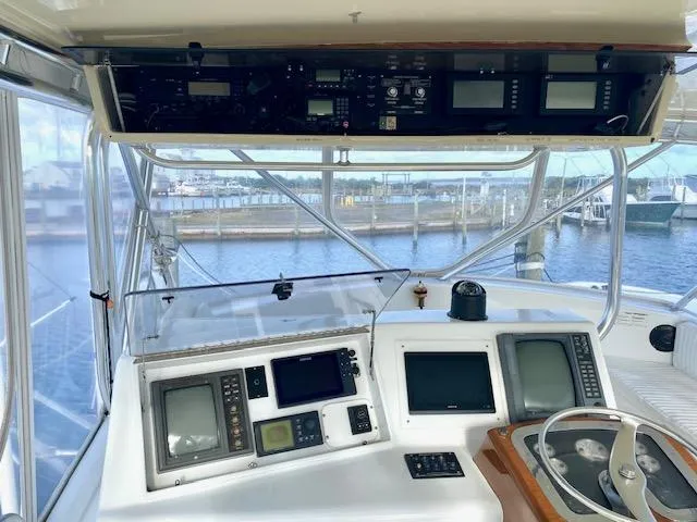 Woodcutter Yacht Photos Pics Helm of 2000 Custom Carolina 56 East Bay yacht with navigation equipment and steering wheel.