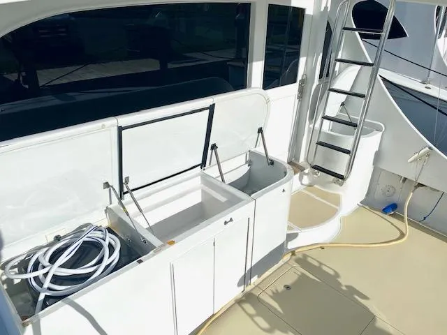 Woodcutter Yacht Photos Pics Custom Carolina 56 East Bay 2000 yacht deck with storage and ladder.