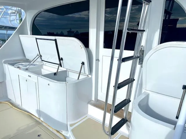 Woodcutter Yacht Photos Pics Custom Carolina 56 East Bay 2000 yacht interior with storage compartments and ladder.