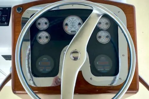 Woodcutter Yacht Photos Pics Steering wheel and dashboard of 2000 Custom Carolina 56 East Bay boat.