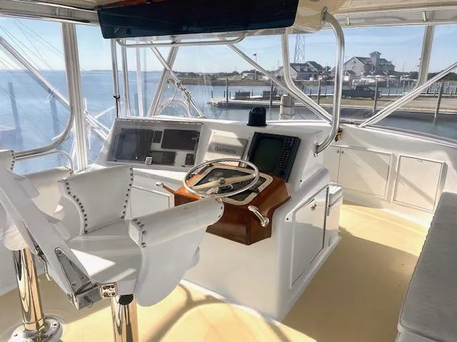 Woodcutter Yacht Photos Pics Custom Carolina 56 East Bay 2000 yacht helm with navigation equipment and ocean view.