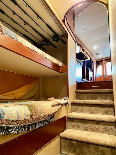 Woodcutter Yacht Photos Pics Interior of 2000 Custom Carolina 56 East Bay yacht with cozy bunks and carpeted stairs.
