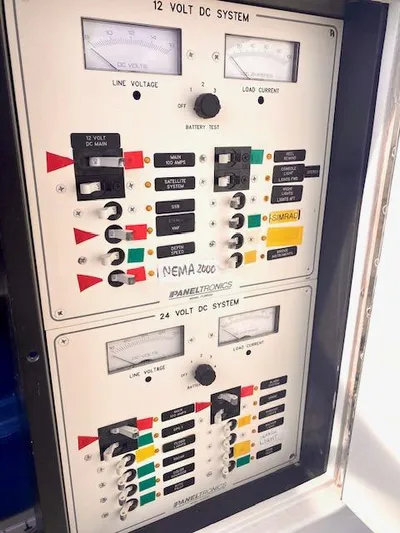 Woodcutter Yacht Photos Pics Control panel of 2000 Custom Carolina 56 East Bay boat, showing 12V and 24V DC systems.