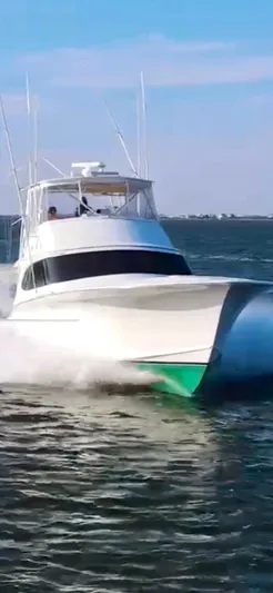 Woodcutter Yacht Photos Pics Custom Carolina 56 East Bay 2000 yacht cruising on open water.