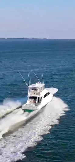 Woodcutter Yacht Photos Pics Custom Carolina 56 East Bay yacht cruising on open water, 2000 model.