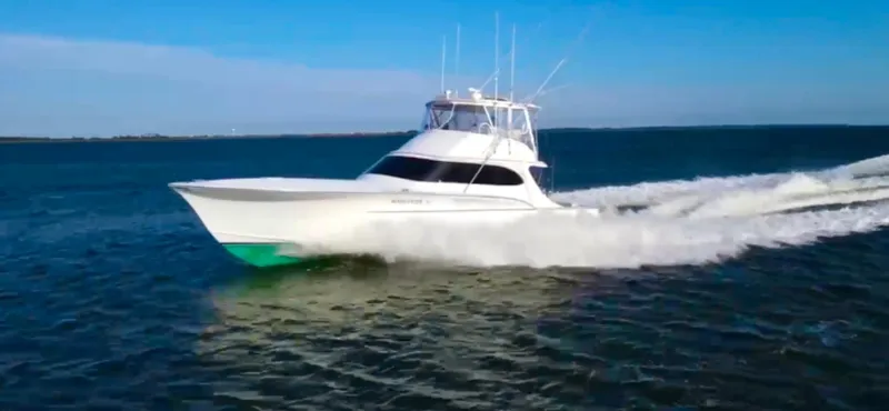 Woodcutter Yacht Photos Pics Custom Carolina 56 East Bay 2000 yacht cruising on open water.