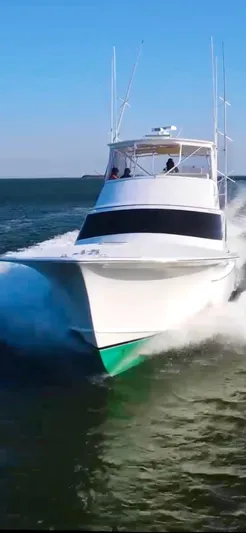 Woodcutter Yacht Photos Pics Custom Carolina 56 East Bay 2000 yacht cruising on open water.