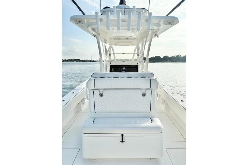  Yacht Photos Pics 2022 SeaHunter 28 Floridian boat interior with cushioned seating and rod holders.