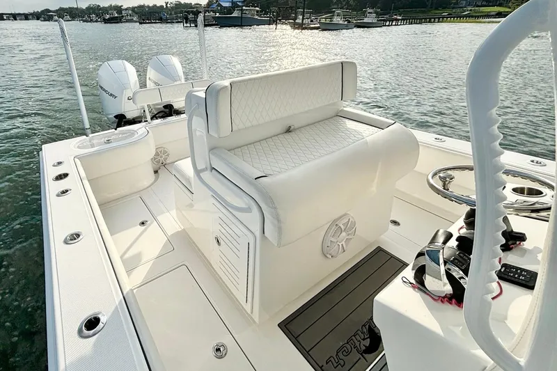  Yacht Photos Pics 2022 SeaHunter 28 Floridian boat interior with dual Mercury engines, white seating, and steering console.