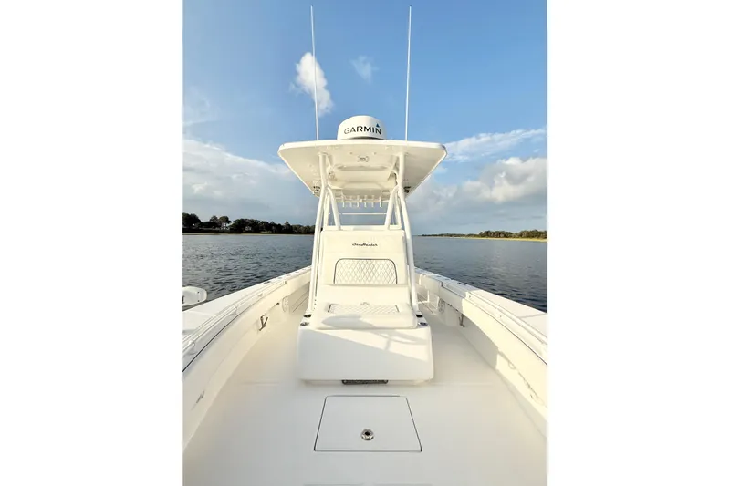  Yacht Photos Pics 2022 SeaHunter 28 Floridian boat on calm water under blue sky.