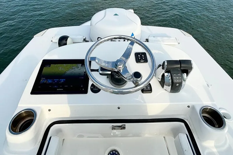  Yacht Photos Pics 2022 SeaHunter 28 Floridian boat helm with steering wheel and navigation system.
